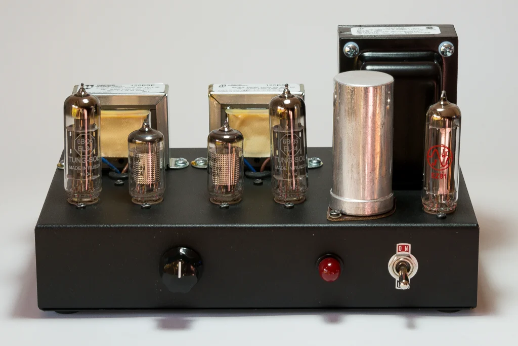 Front view of the 1955 Gen2 EL84 single-ended stereo tube amplifier with volume control, pilot lamp and power switch.