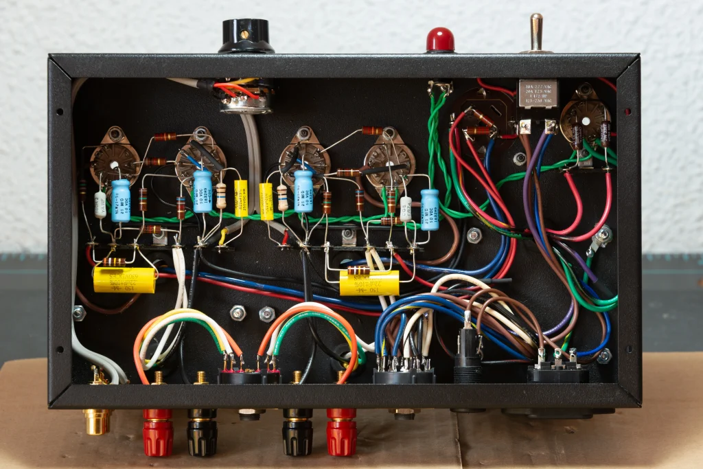 Interior view of the 1955 Gen2 amplifier showing point-to-point wiring, tube sockets, switches and signal components.